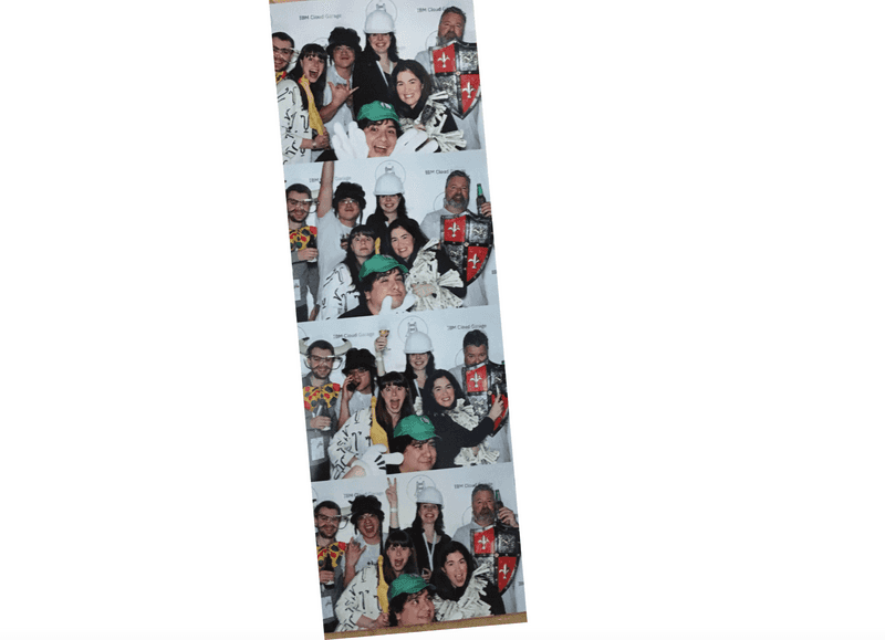 A photo booth strip showing IBM Cloud Garage staff in silly hats